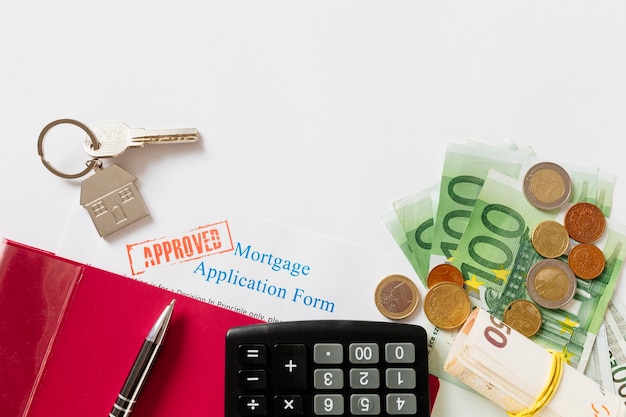 Free photo approved mortgage contract and key with money