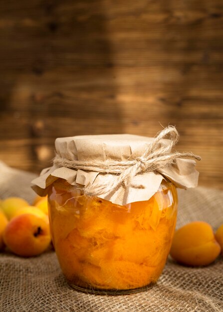 Apricot compote in jar arrangement