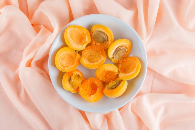 Apricots in a plate. flat lay.