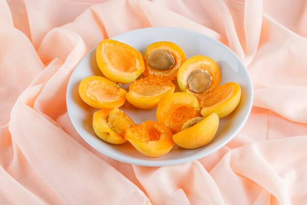 Apricots in a plate. top view.