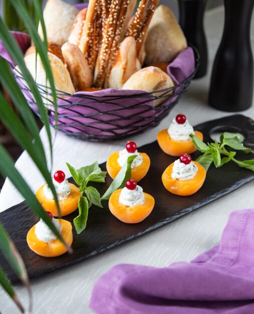 Apricots with cream and cherry
