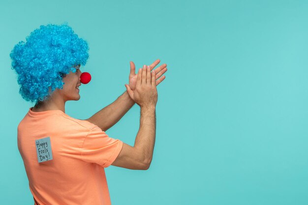 April fools day guy clown smiling clapping hands blue hair blue post it sticker note funny red nose