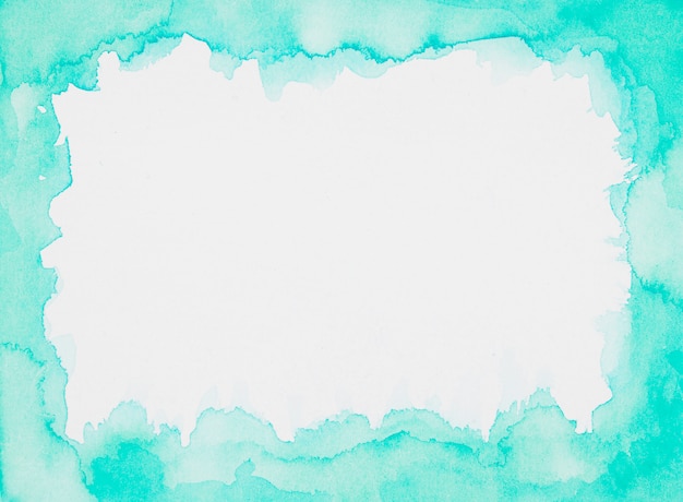 Aquamarine frame of paints on white sheet