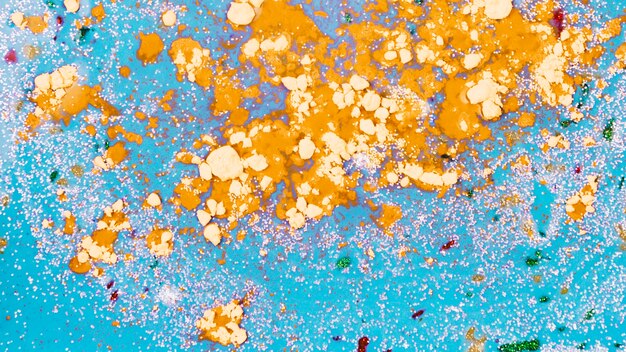 Aquamarine liquid with orange crumbs