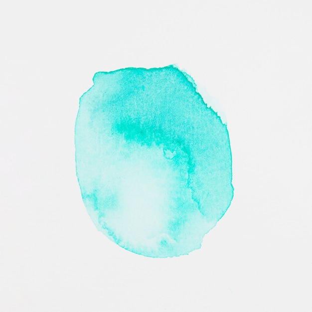 Aquamarine paints in form of circle on white paper