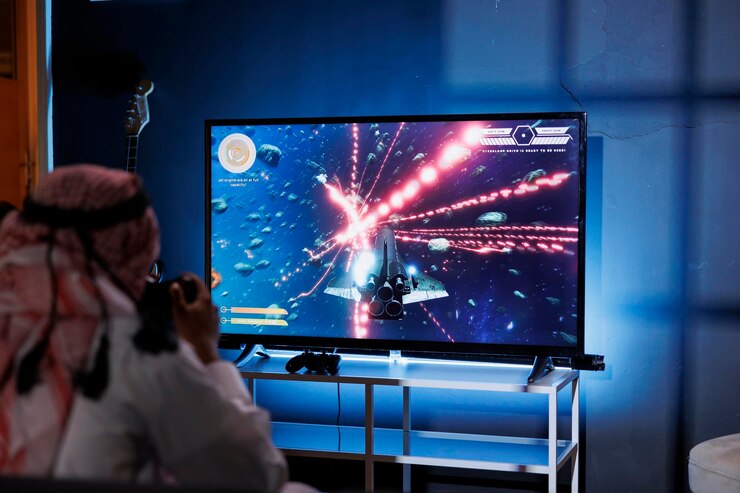 無料Photo テレビでゲームをしているアラブ人
