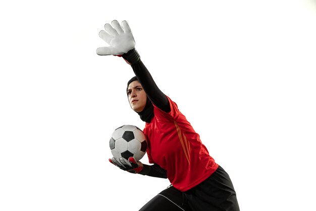 Arabian female goalkeeper on white studio wall