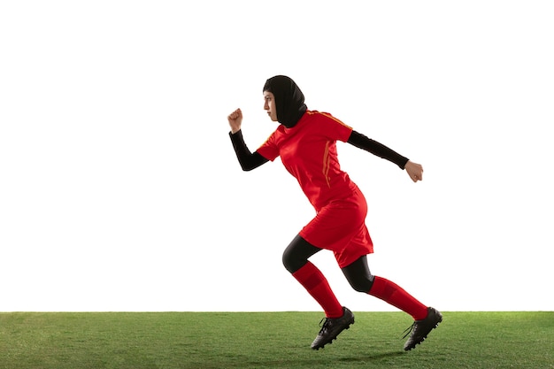 Arabian female soccer player running