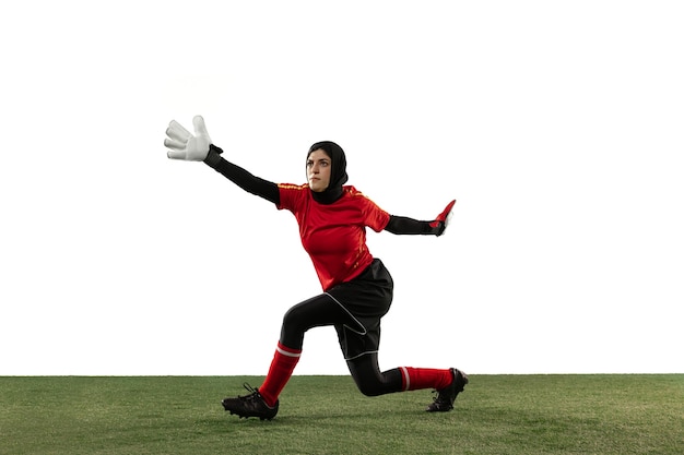 Arabian goalkeeper on white studio wall