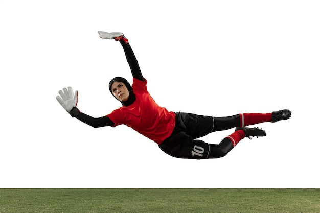 Arabian goalkeeper on white studio wall