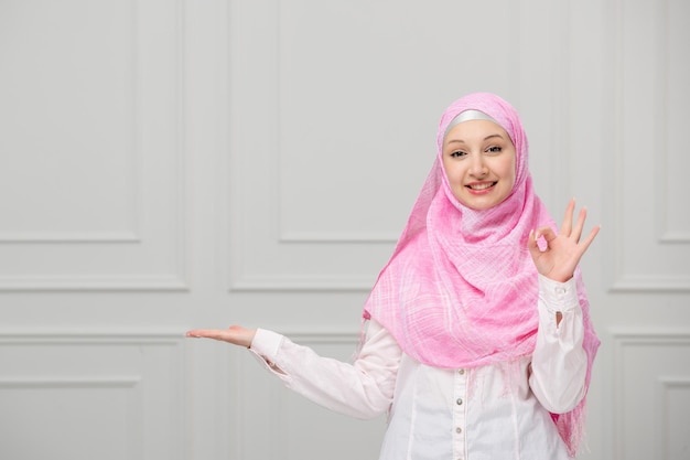 Free photo arabic girl cute pretty young muslim woman covered in beautiful pink hijab very confident