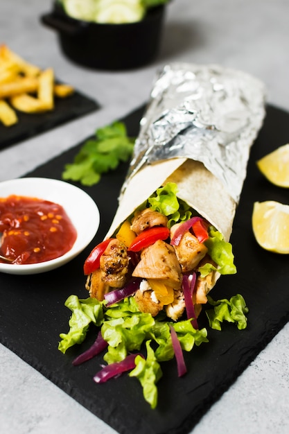 Arabic kebab sandwich in aluminium foil