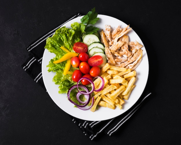 Arabic kebab sandwich and veggies with french fries