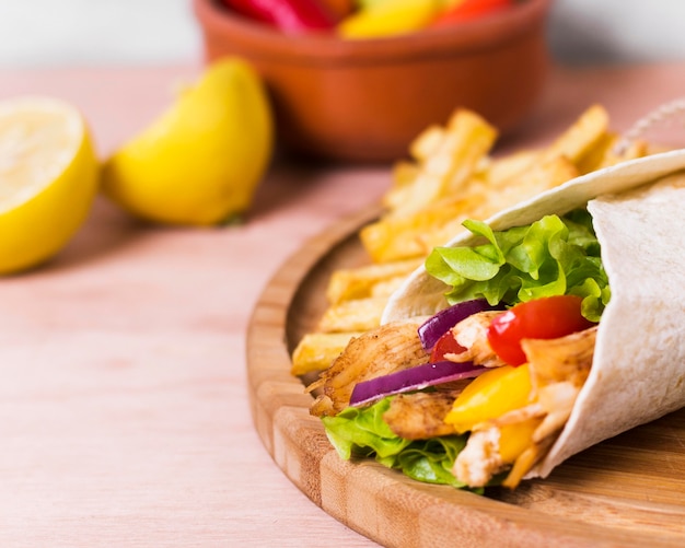 Arabic kebab sandwich wrapped in white paper close-up