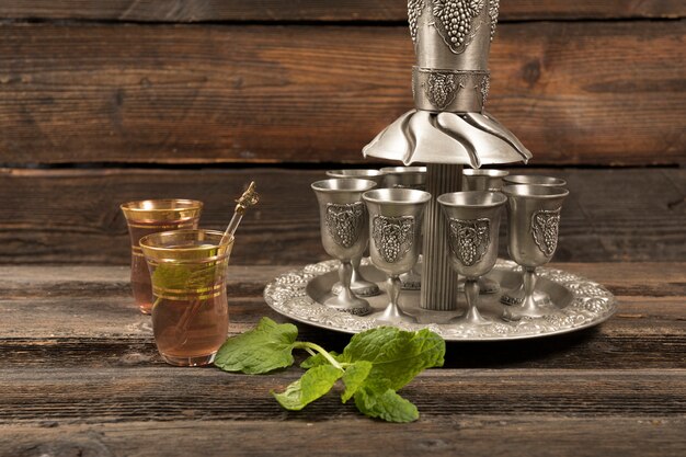 Arabic tea in glasses with cups on tray