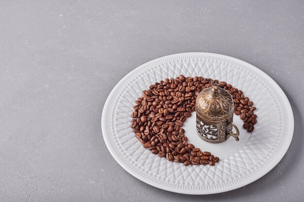 Arabica beans in a white plate.