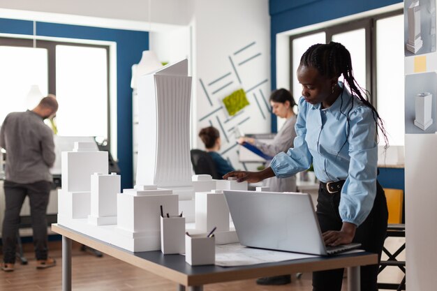 Architect african american woman working on laptop