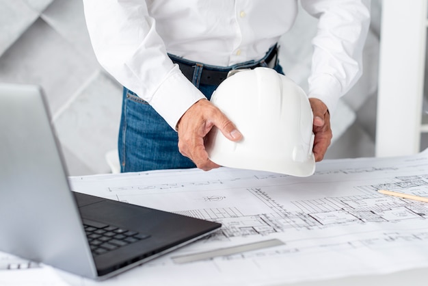 Free photo architect arranging his desk with tools