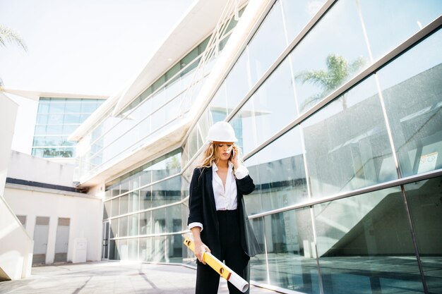 Architect in front of glass building