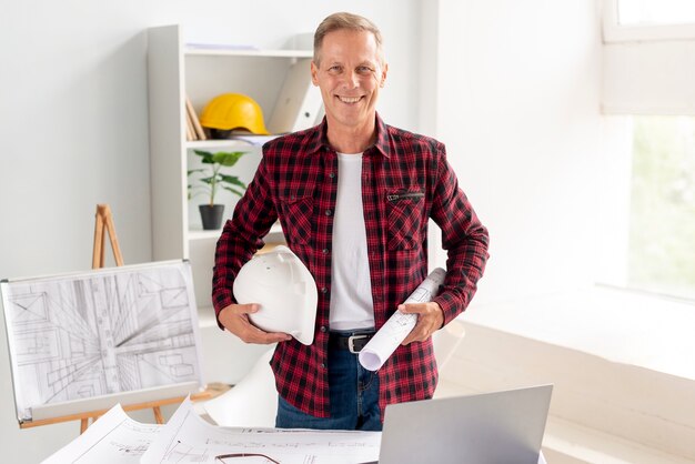 Architect smiling while posing at the office