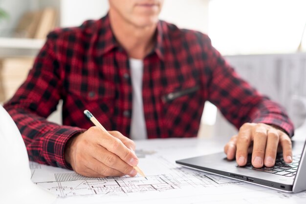 Architect using his laptop for project