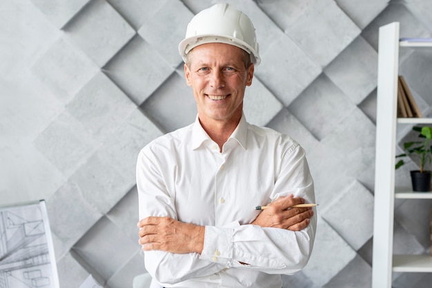 Architect with safety helmet posing