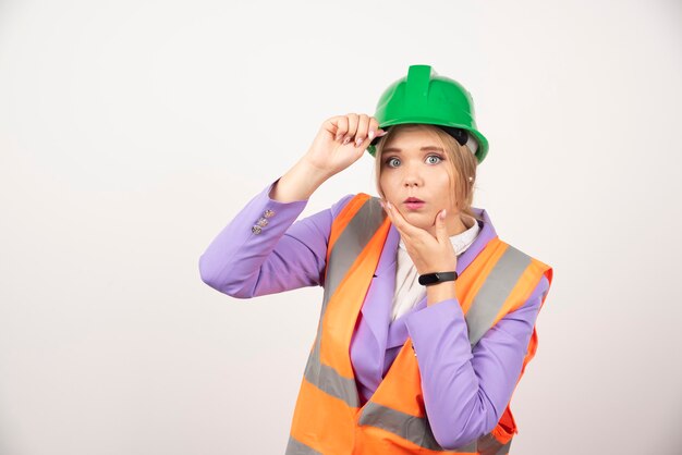 architect woman in helmet on white.