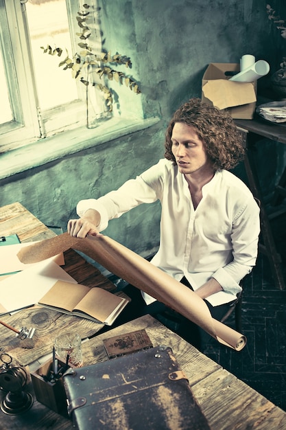 Architect working on drawing table in office