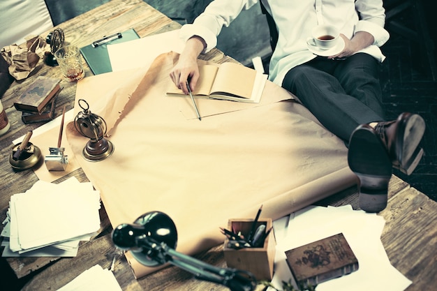 Architect working on drawing table in office