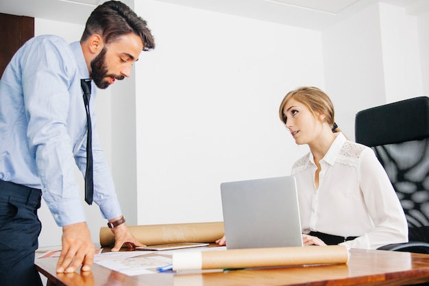 Architects talking at desk