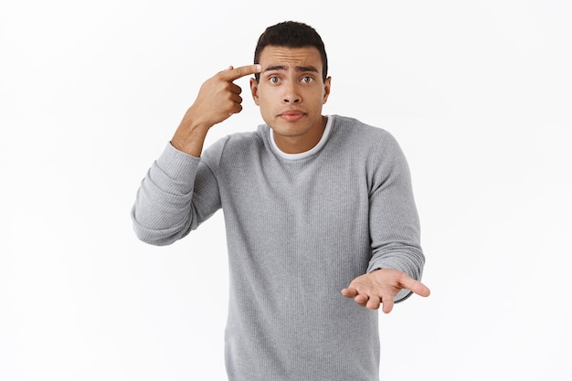 Free photo are you stupid?.  african-american man pointing at forehead