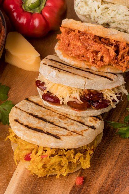 Arepas arrangement on wooden board