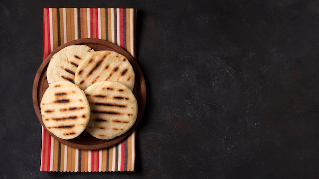 Arepas on plate with copy-space