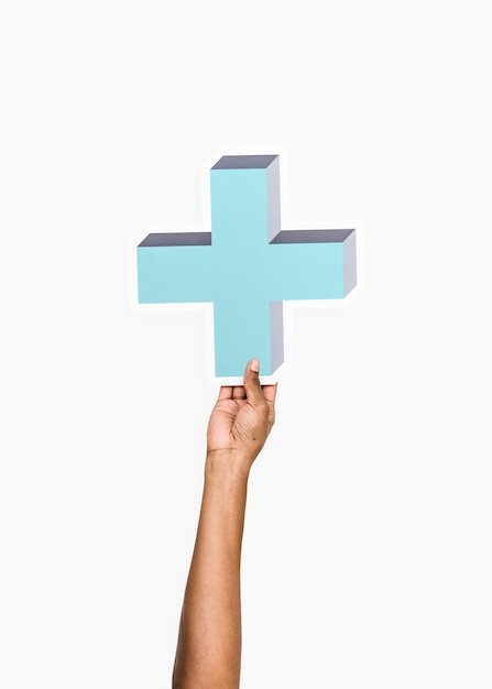 Free photo arm raised and holding blue cross icon