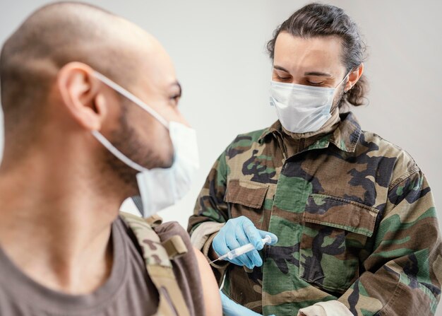 Army man getting vaccinated