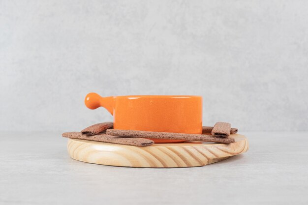 Aroma coffee and cocoa biscuits on wooden plate