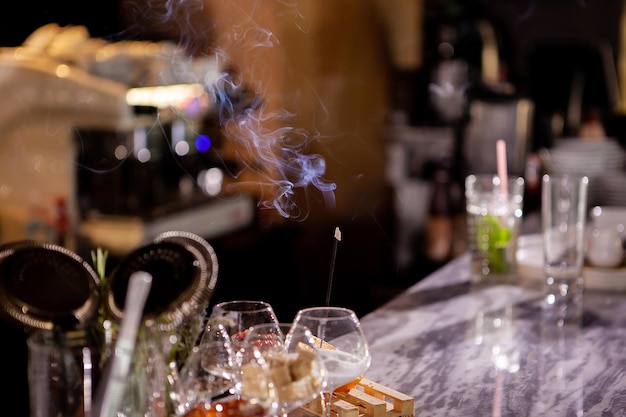 Aromatic smoke sticks on bar counter.