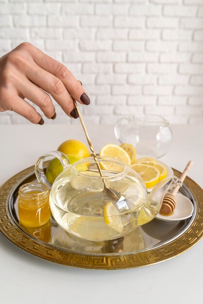 Aromatic tea with lemon on table