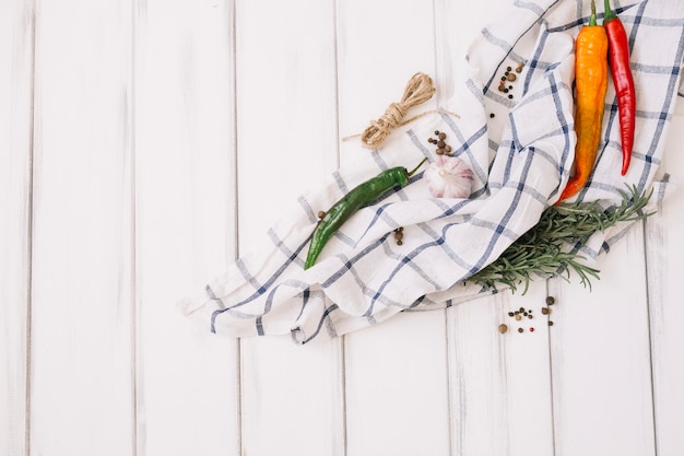 Free photo arrange vegetables and herbs on towel