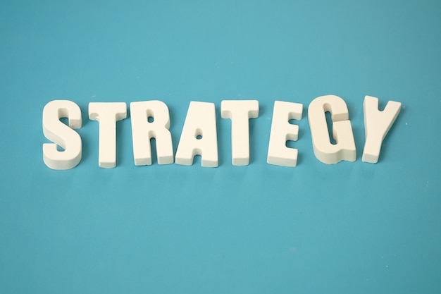 arrange white letters STRATEGY