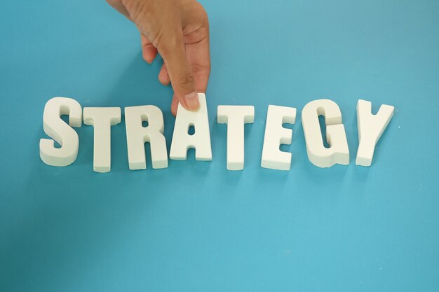 Free photo arrange white letters strategy