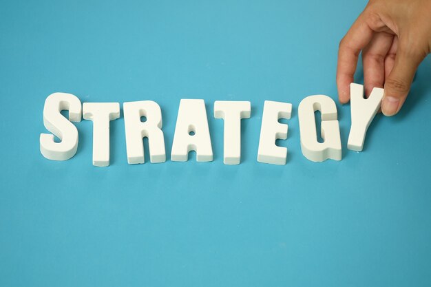 arrange white letters STRATEGY