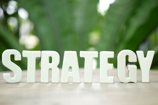 arrange white letters STRATEGY