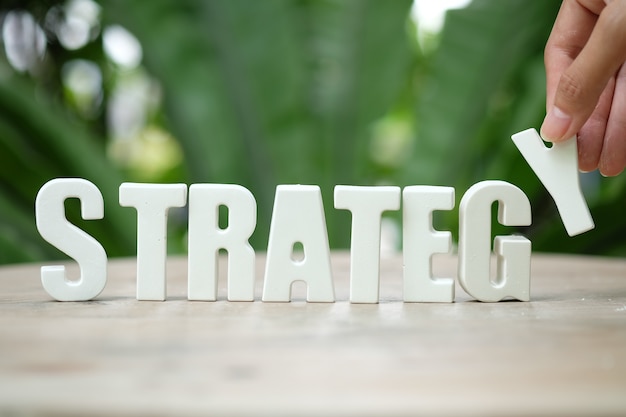 arrange white letters STRATEGY