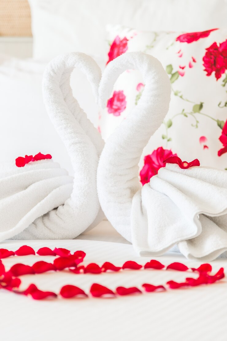 Free Photo arranged aesthetic towel pillow rose