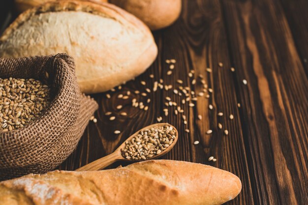 Arranged cereals and bread on wood