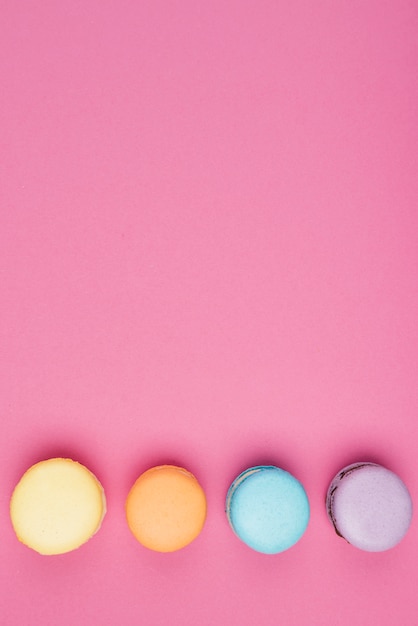 Free photo arranged colorful macaroons with copy-space