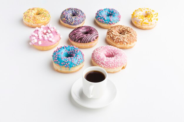 Arranged donuts with coffee