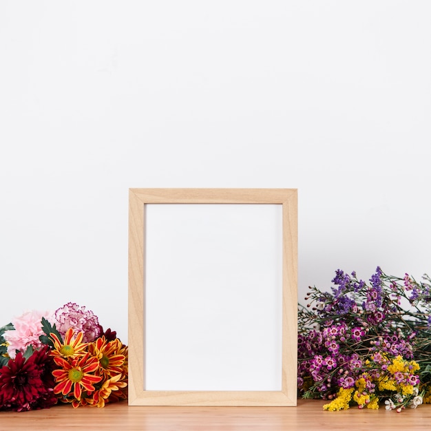 Arranged empty frame and flowers