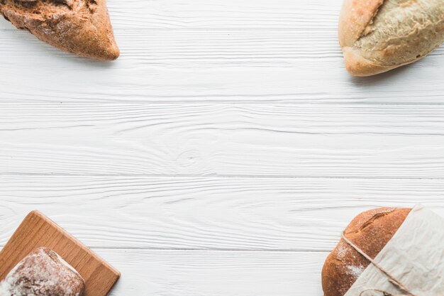 Arranged loaves on white table